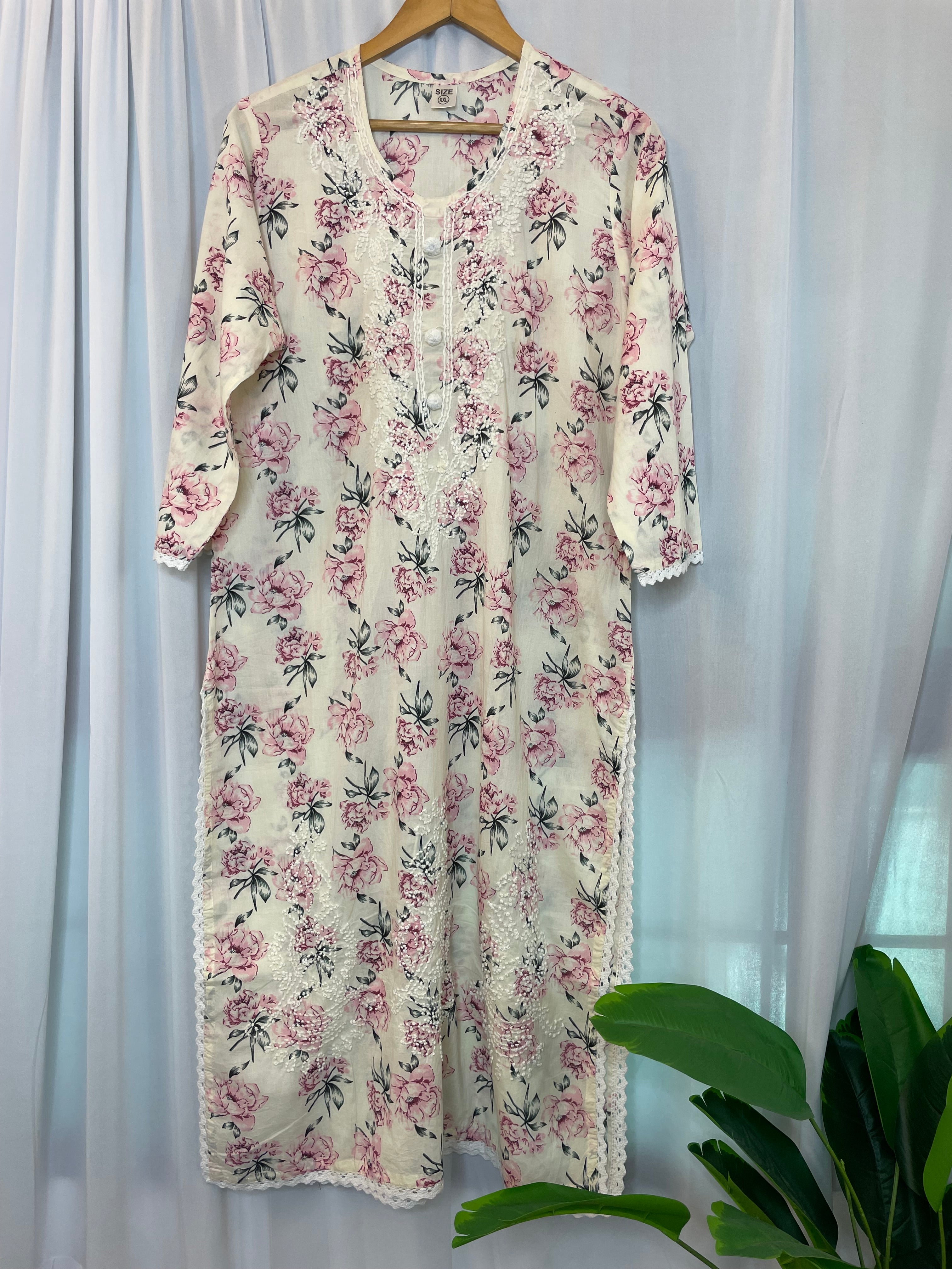Floral printed cotton embroidered kurti .